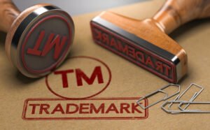 Rubber stamps with the word trademark and the symbol tm over brown paper background